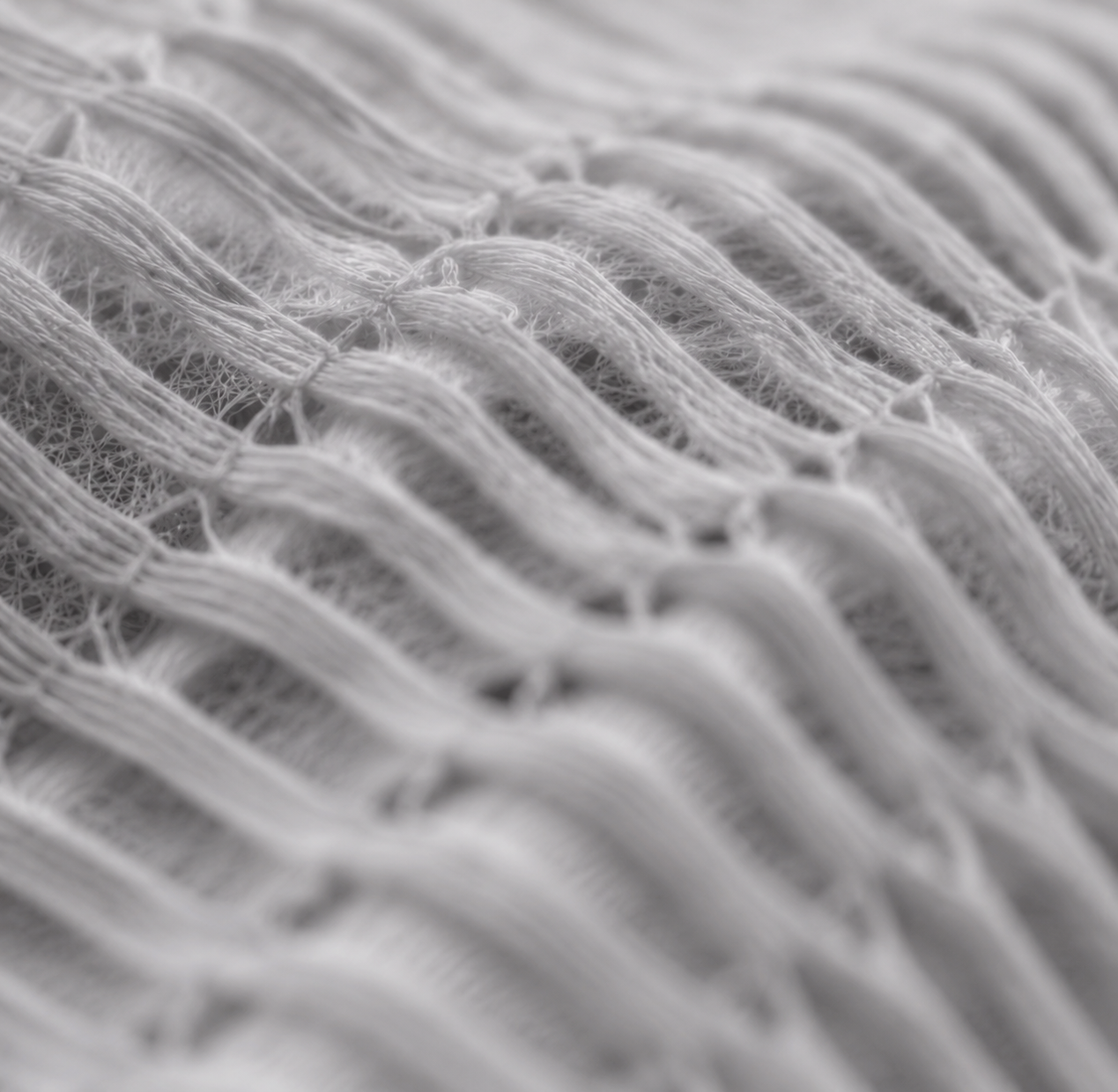 Soft layered white textile structure illustrating material and moisture movement
