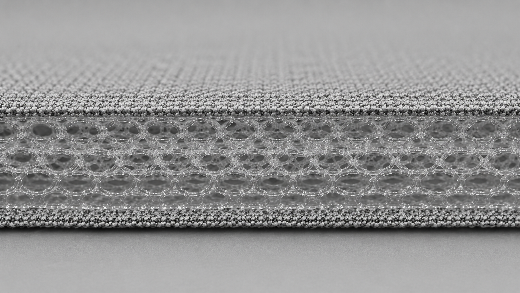 Layered light textile and open-cell cushioning structure for pet-care applications